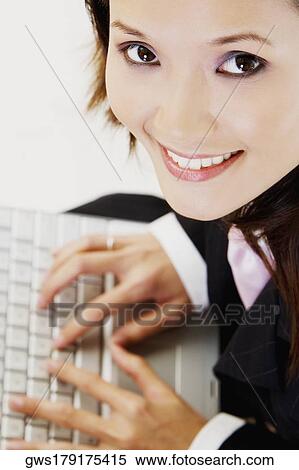 Portrait of a businesswoman using a laptop View Large Photo Image Stock Photography - Portrait of a businesswoman using a laptop. Fotosearch
