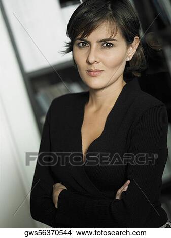 Portrait of a businesswoman with her arms crossed View Large Photo Image Picture - Portrait of a businesswoman with her arms crossed. Fotosearch