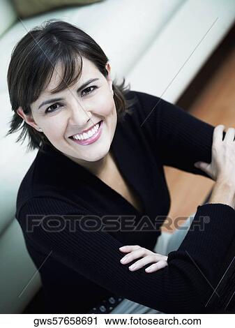 Stock Image - Portrait of a businesswoman with her arms crossed. Fotosearch