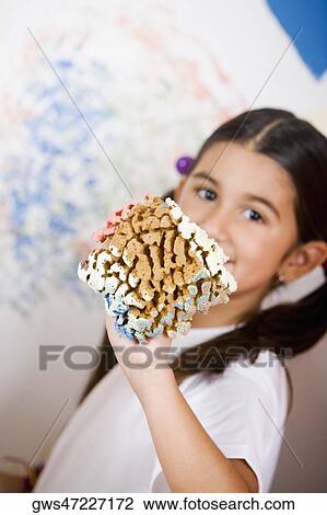 Portrait of a girl holding a sponge View Large Photo Image Stock Image - Portrait of a girl holding a sponge. Fotosearch