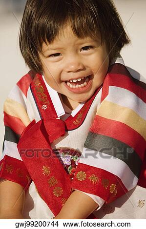 Portrait of a girl in traditional clothing laughing View Large Photo Image Picture - Portrait of a girl in traditional clothing laughing. Fotosearch