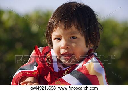 Portrait of a girl in traditional clothing View Large Photo Image Stock Photo - Portrait of a girl in traditional clothing. Fotosearch
