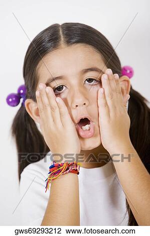 Portrait of a girl rubbing her face View Large Photo Image Stock Image - Portrait of a girl rubbing her face. Fotosearch