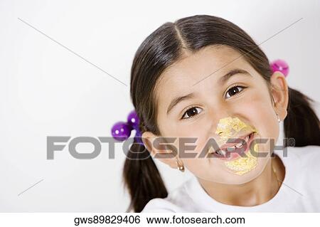Portrait of a girl with cream on her face View Large Photo Image Stock Photograph - Portrait of a girl with cream on her face. Fotosearch