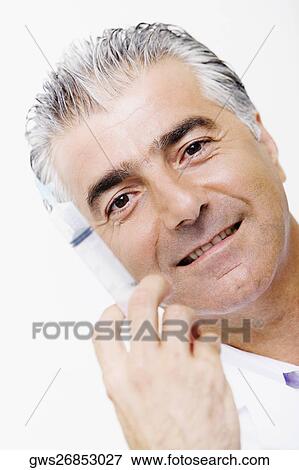 Portrait of a male doctor holding a syringe View Large Photo Image Stock Photo - Portrait of a male doctor holding a syringe. Fotosearch