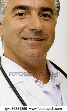Portrait of a male doctor with a stethoscope around his neck View Large Photo Image Stock Photo - Portrait of a male doctor with a stethoscope around his neck. Fotosearch