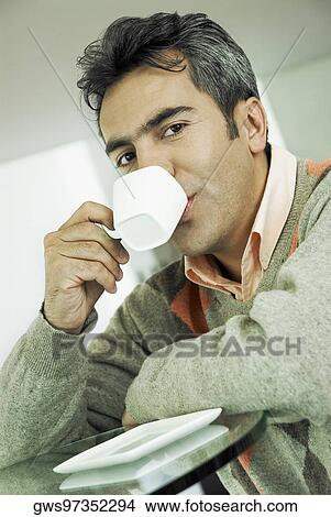 Picture - Portrait of a mature man drinking tea. Fotosearch
