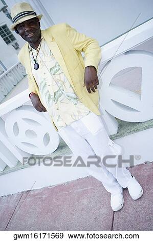 Portrait of a mature man leaning against a balustrade View Large Photo Image Stock Photo - Portrait of a mature man leaning against a balustrade. Fotosearch