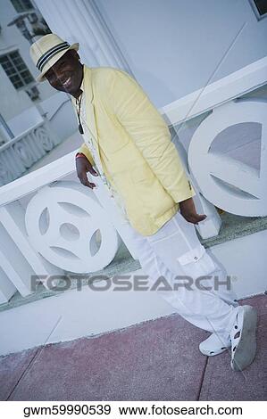 Stock Photo - Portrait of a mature man leaning against a balustrade. Fotosearch