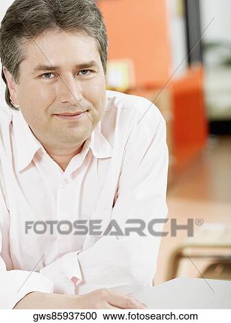 Portrait of a mature man smiling View Large Photo Image Stock Image - Portrait of a mature man smiling. Fotosearch