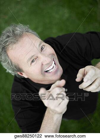 Portrait of a mature man smiling View Large Photo Image Stock Image - Portrait of a mature man smiling. Fotosearch