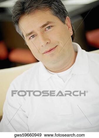 Stock Photo - Portrait of a mature man smirking. Fotosearch