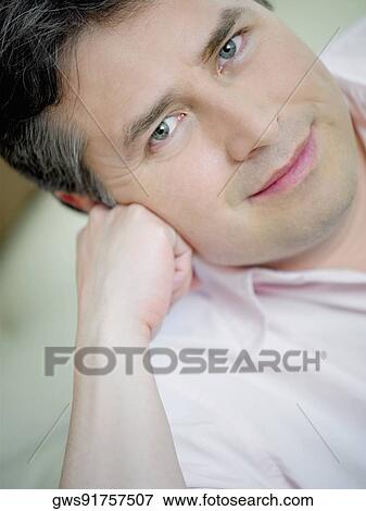Stock Photo - Portrait of a mature man thinking. Fotosearch