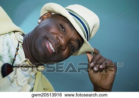 Portrait of a mature man tipping his hat View Large Photo Image Stock Photograph - Portrait of a mature man tipping his hat. Fotosearch