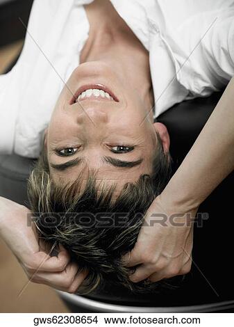 Picture - Portrait of a mature woman lying on her back. Fotosearch