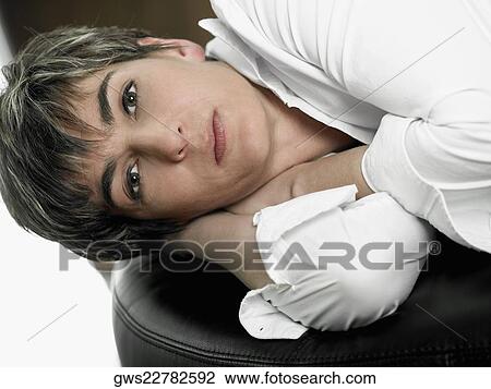 Portrait of a mature woman lying on her side View Large Photo Image Stock Image - Portrait of a mature woman lying on her side. Fotosearch