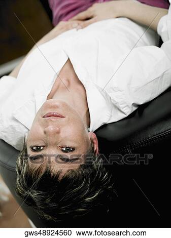 Portrait of a mature woman lying on her back View Large Photo Image Stock Image - Portrait of a mature woman lying on her back. Fotosearch
