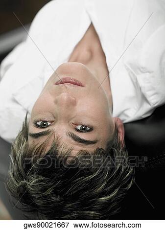 Portrait of a mature woman lying on her back View Large Photo Image Stock Photo - Portrait of a mature woman lying on her back. Fotosearch