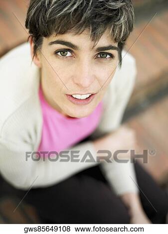 Portrait of a mature woman sitting on steps View Large Photo Image Stock Photo - Portrait of a mature woman sitting on steps. Fotosearch