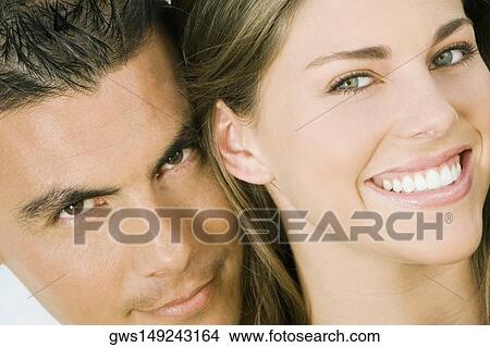 Portrait of a mid adult couple smiling View Large Photo Image Picture - Portrait of a mid adult couple smiling. Fotosearch