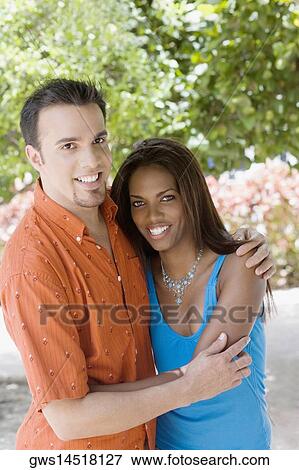 Portrait of a mid adult man and a teenage girl embracing each other View Large Photo Image Stock Photo - Portrait of a mid adult man and a teenage girl embracing each other. Fotosearch