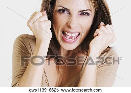 Stock Photography - Portrait of a mid adult woman looking frustrated. Fotosearch
