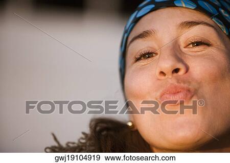Portrait of a mid adult woman puckering her lips View Large Photo Image Stock Photo - Portrait of a mid adult woman puckering her lips. Fotosearch