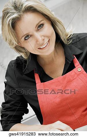 Stock Image - Portrait of a mid adult woman smiling. Fotosearch