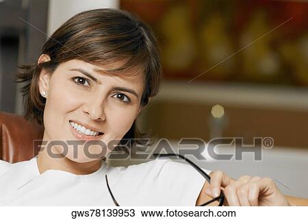 Stock Image - Portrait of a mid adult woman smiling. Fotosearch
