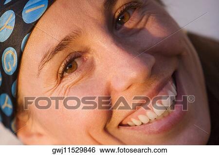 Portrait of a mid adult woman smiling View Large Photo Image Stock Photograph - Portrait of a mid adult woman smiling. Fotosearch