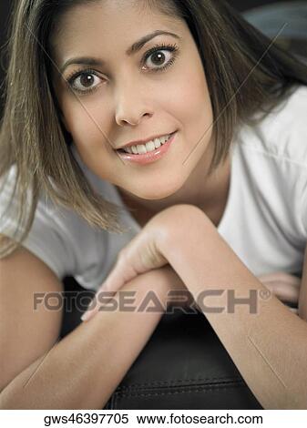 Stock Photography - Portrait of a mid adult woman smiling. Fotosearch