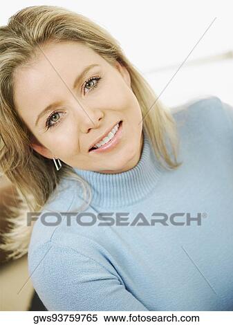 Portrait of a mid adult woman smiling View Large Photo Image Stock Photography - Portrait of a mid adult woman smiling. Fotosearch