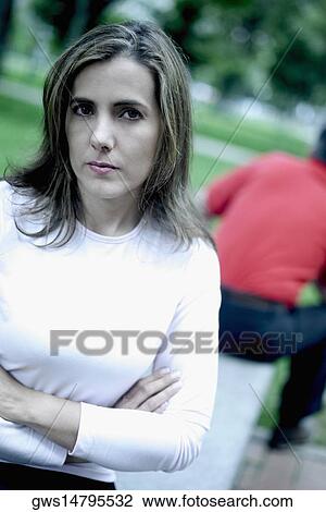 Portrait of a mid adult woman with her arms folded View Large Photo Image Stock Image - Portrait of a mid adult woman with her arms folded. Fotosearch