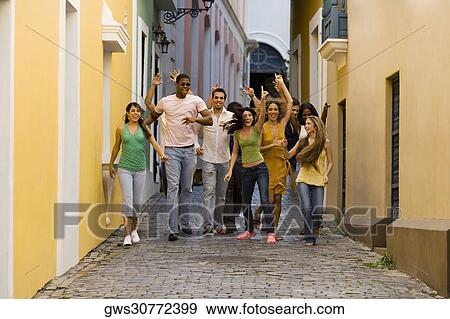 Portrait of a teenage girl and her friends on the street View Large Photo Image Stock Photo - Portrait of a teenage girl and her friends on the street. Fotosearch