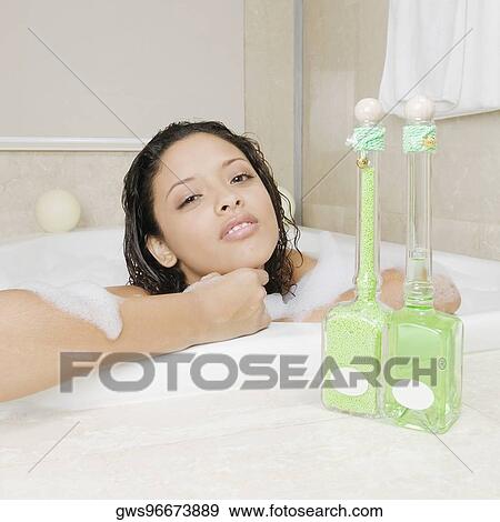 Stock Photo - Portrait of a teenage girl having a bath. Fotosearch