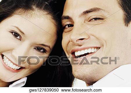 Portrait of a young couple smiling View Large Photo Image Stock Image - Portrait of a young couple smiling. Fotosearch