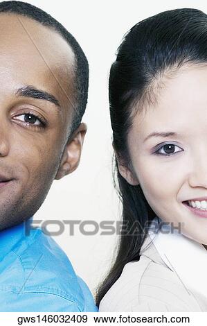 Portrait of a young couple smiling View Large Photo Image Stock Photo - Portrait of a young couple smiling. Fotosearch