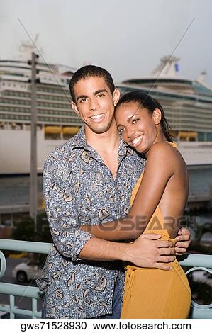 Portrait of a young man and a teenage girl embracing each other View Large Photo Image Stock Image - Portrait of a young man and a teenage girl embracing each other. Fotosearch