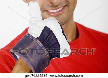 Stock Photography - Portrait of a young man showing Thumbs Up sign. Fotosearch