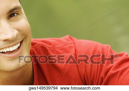 Portrait of a young man smiling View Large Photo Image Picture - Portrait of a young man smiling. Fotosearch