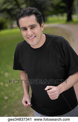 Stock Image - Portrait of a young man smiling. Fotosearch