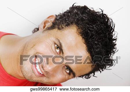 Portrait of a young man with a paint can smiling View Large Photo Image Stock Photo - Portrait of a young man with a paint can smiling. Fotosearch