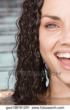 Portrait of a young woman in a swimming pool View Large Photo Image Stock Image - Portrait of a young woman in a swimming pool. Fotosearch