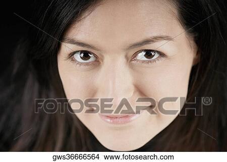 Portrait of a young woman smiling View Large Photo Image Picture - Portrait of a young woman smiling. Fotosearch