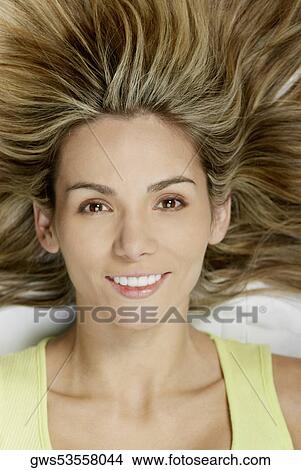 Picture - Portrait of a young woman smiling. Fotosearch