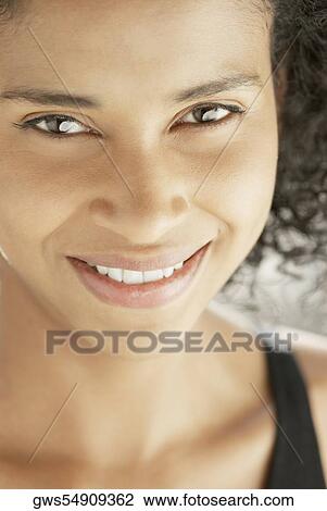 Portrait of a young woman smiling View Large Photo Image Stock Image - Portrait of a young woman smiling. Fotosearch
