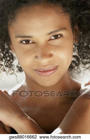 Portrait of a young woman smiling View Large Photo Image Stock Image - Portrait of a young woman smiling. Fotosearch