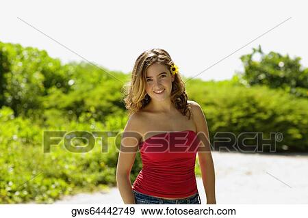 Stock Photo - Portrait of a young woman smiling. Fotosearch