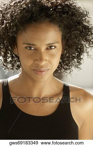 Portrait of a young woman View Large Photo Image Stock Photo - Portrait of a young woman. Fotosearch