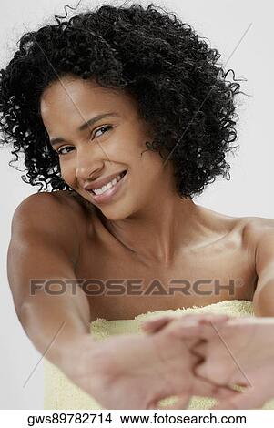 Portrait of a young woman stretching her arms and smiling View Large Photo Image Picture - Portrait of a young woman stretching her arms and smiling. Fotosearch